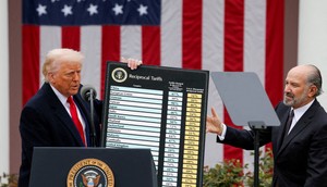 Wells Fargo says in a report that President Donald Trump's tariffs won't bring manufacturing back.Carlos Barria/REUTERS