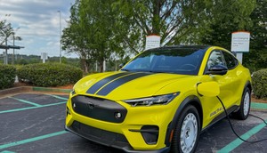 The 2025 Ford Mustang Mach-E Rally is plugged into a Level 2 ChargePoint charger.Benjamin Zhang/Business Insider